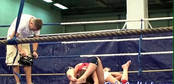 Muscular lesbians wrestling in a boxing ring